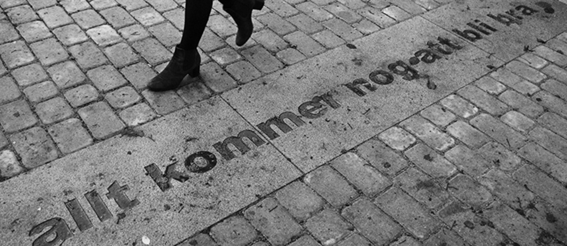 feet walking on the pavement